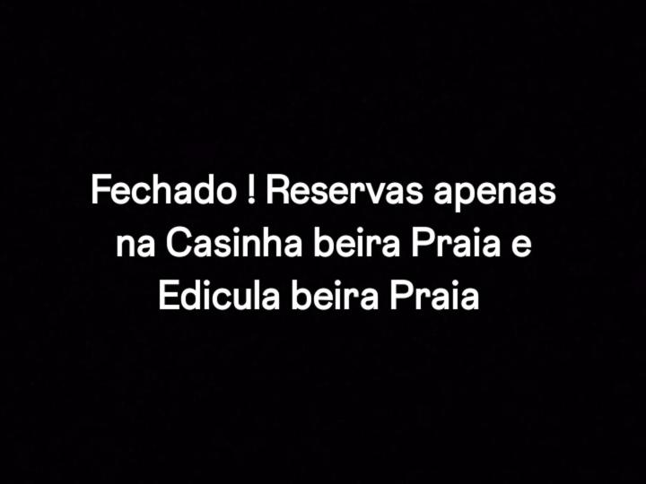 a sign with the words federico ireslezaeaaea ma casitasemia at Reservasnacasinhabeirapraia in Itanhaém