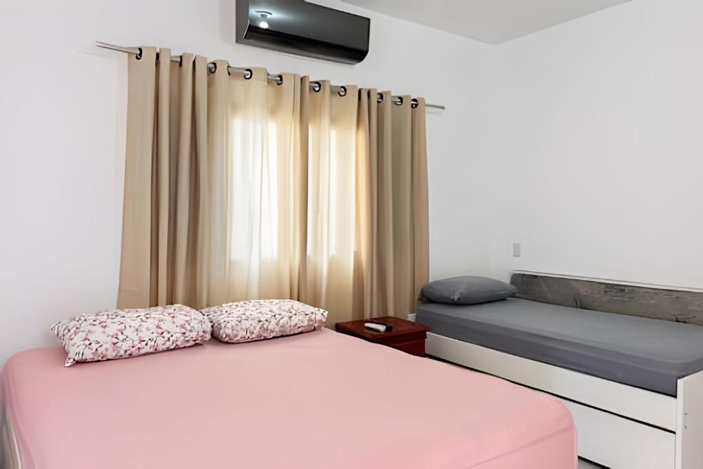 Postel nebo postele na pokoji v ubytování Lisjoy: Casa de Campo Aconchegante