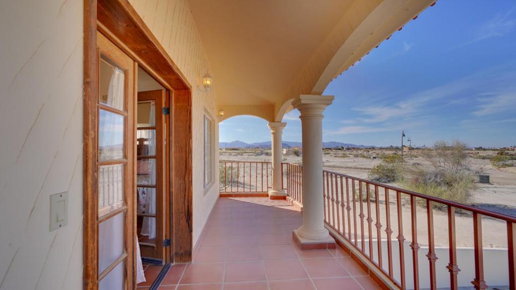 a balcony of a house with a view of the desert at Casa La Vida Dulce in El Dorado Ranch San Felipe. 18-Hole Golf Course in Playa El Paraíso