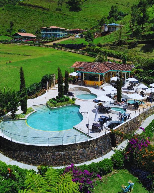 an aerial view of a resort with a swimming pool at Hotel Lago Valdivia in Jardin