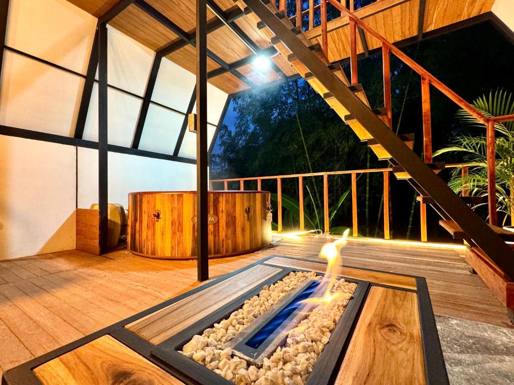 a person playing in a pool on a deck at Cabaña con jacuzzi en Venecia in Venecia