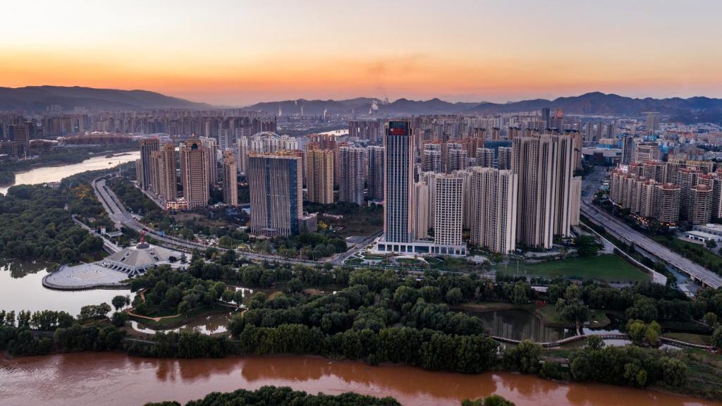 an aerial view of a city at sunset at Hilton Garden Inn Lanzhou Anning in Lanzhou