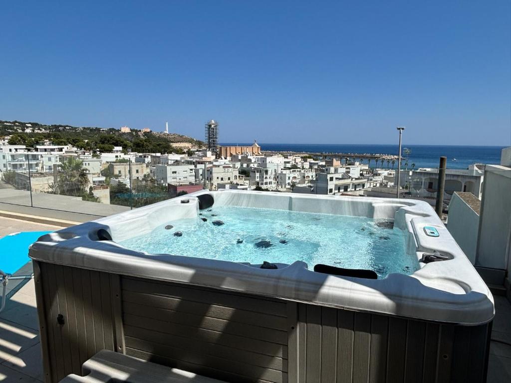 a hot tub on the balcony of a building at Clara Grace sea view in Leuca
