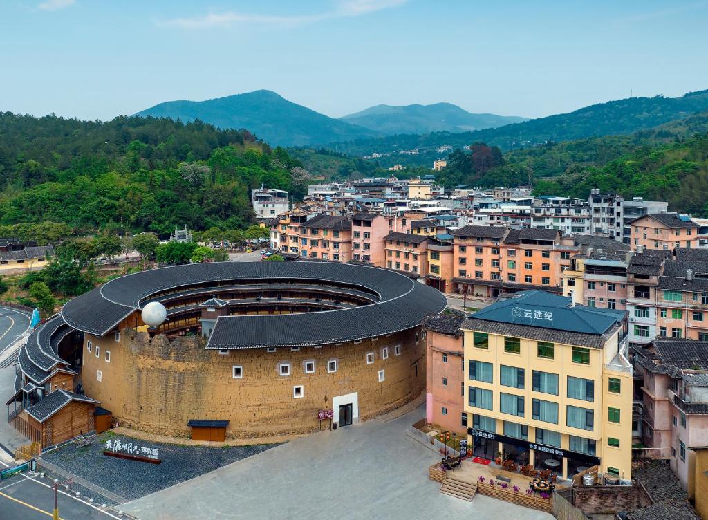 an overhead view of a building in a city at Yuntuji Homestay, Yongding Tulou Branch, Longyan in Bajia