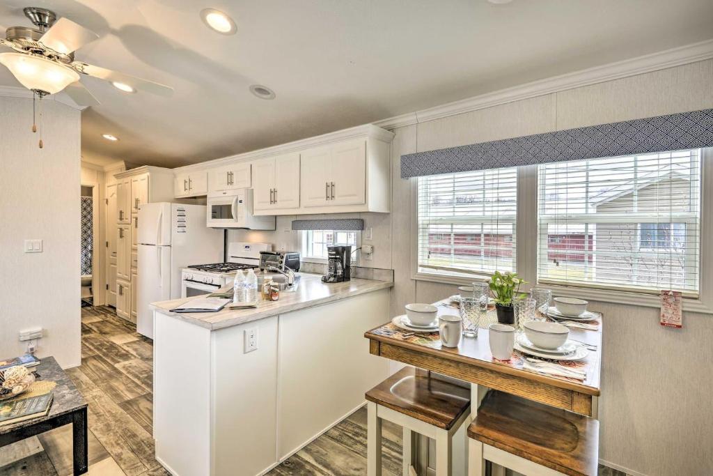 a kitchen with white cabinets and a counter top at Dosanko Cottage & Fjord Suite at Equestrian House PA in Pleasant Mount