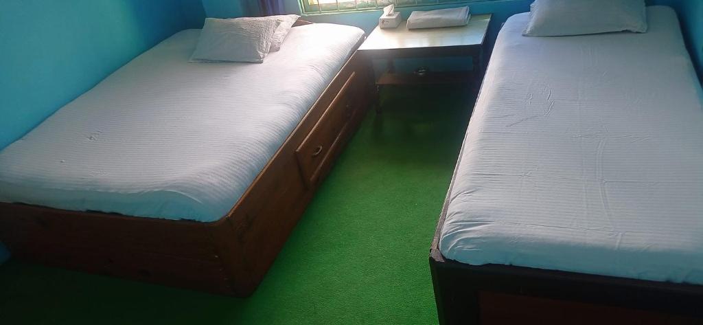 Postel nebo postele na pokoji v ubytování Shubh laxmi hotel Itahari