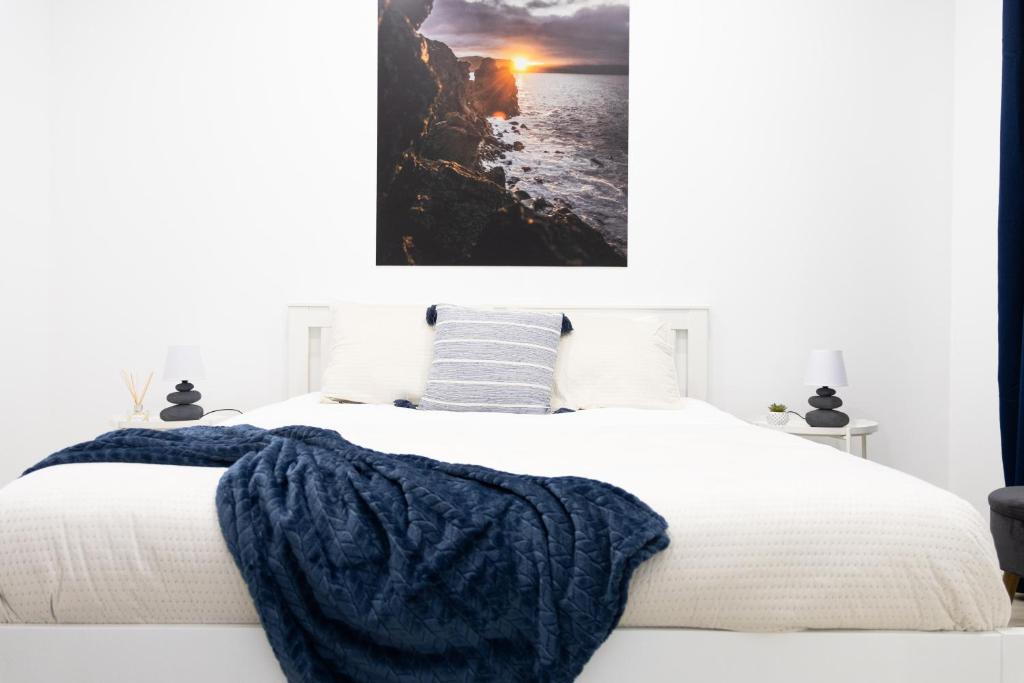 En eller flere senge i et værelse på Casa Pedra de Sal