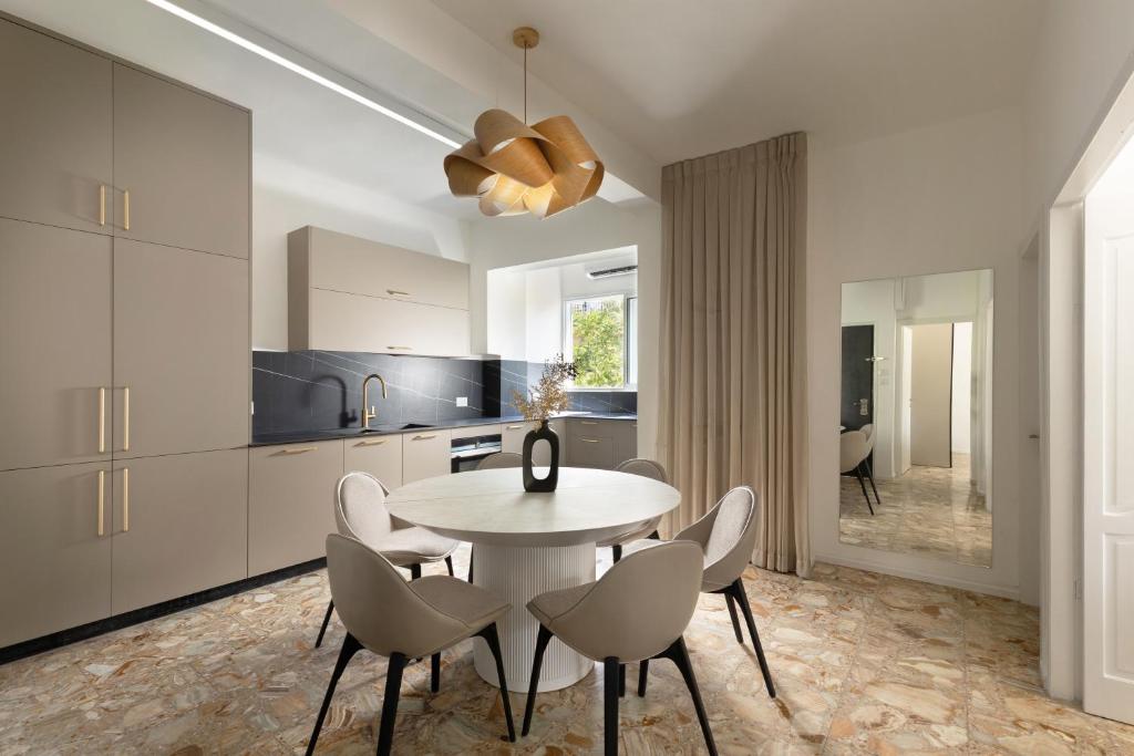 a kitchen and dining room with a table and chairs at The charm of Jerusalem in Jerusalem