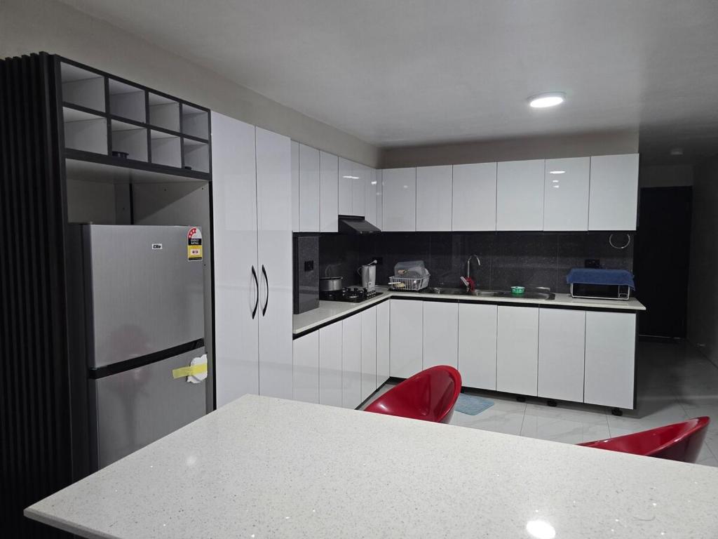 Η κουζίνα ή μικρή κουζίνα στο Raiwai homestay