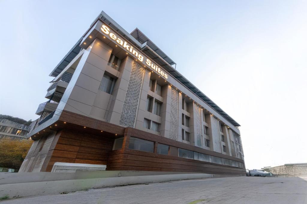a building with lights on the side of it at Seaking Suites in Ernakulam