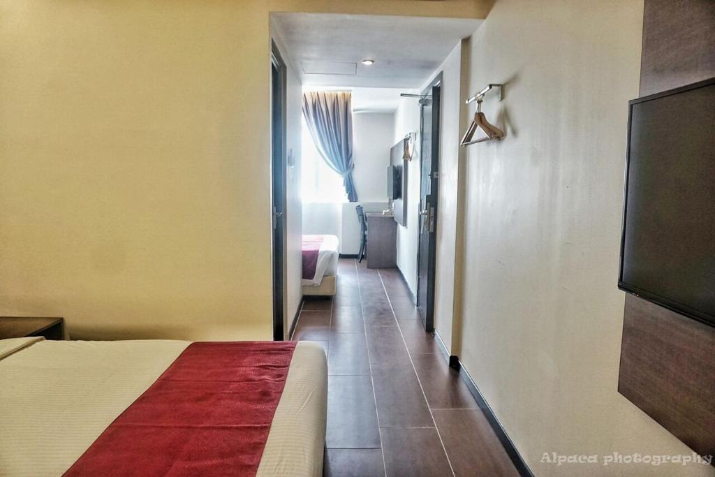 Postel nebo postele na pokoji v ubytování Nex Hotel Johor Bahru
