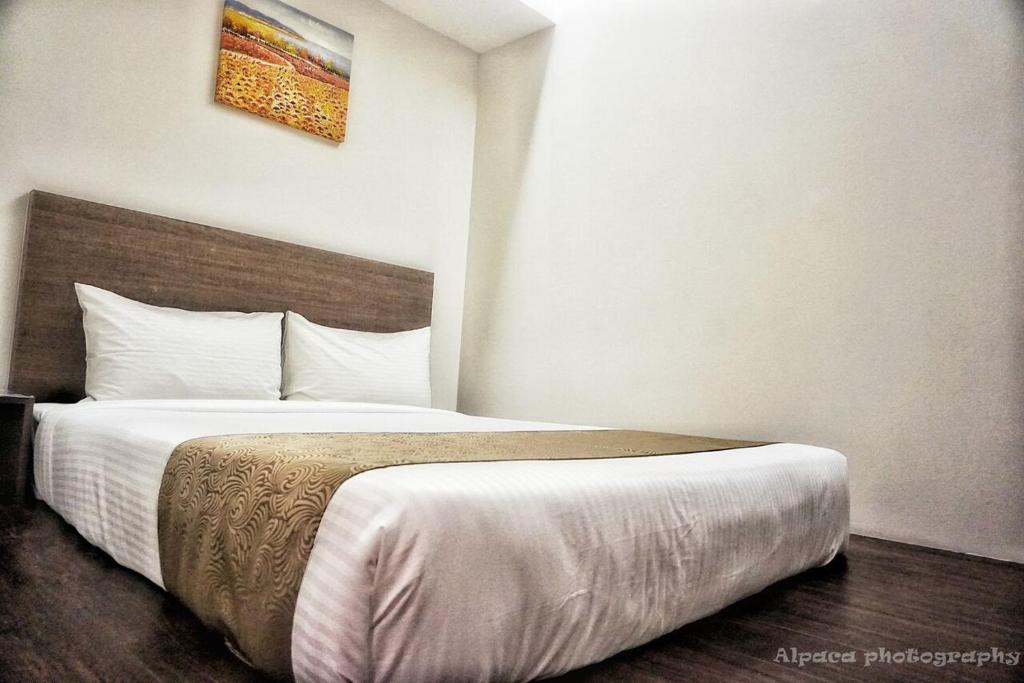 Postel nebo postele na pokoji v ubytování Nex Hotel Johor Bahru