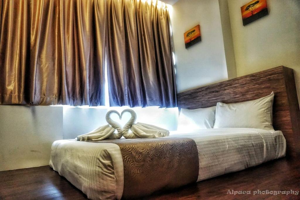 Postel nebo postele na pokoji v ubytování Nex Hotel Johor Bahru