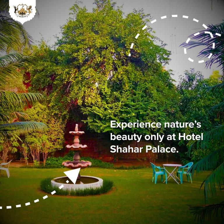 an image of a park with a fountain in the grass at Shahar Palace in Jāmb