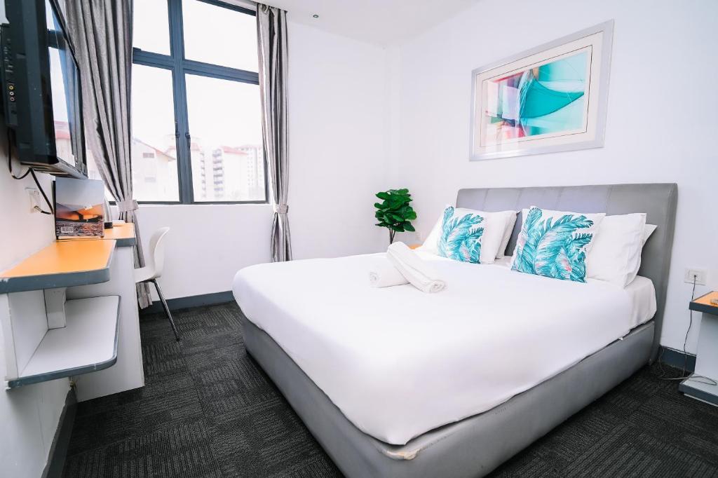 Ένα ή περισσότερα κρεβάτια σε δωμάτιο στο Swing & Pillows - KL Sg Besi, Kuala Lumpur