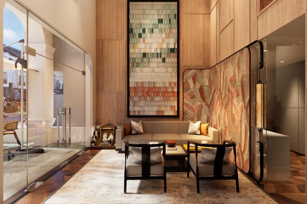 a living room with a couch and a table at HAITA Suites in Ho Chi Minh City