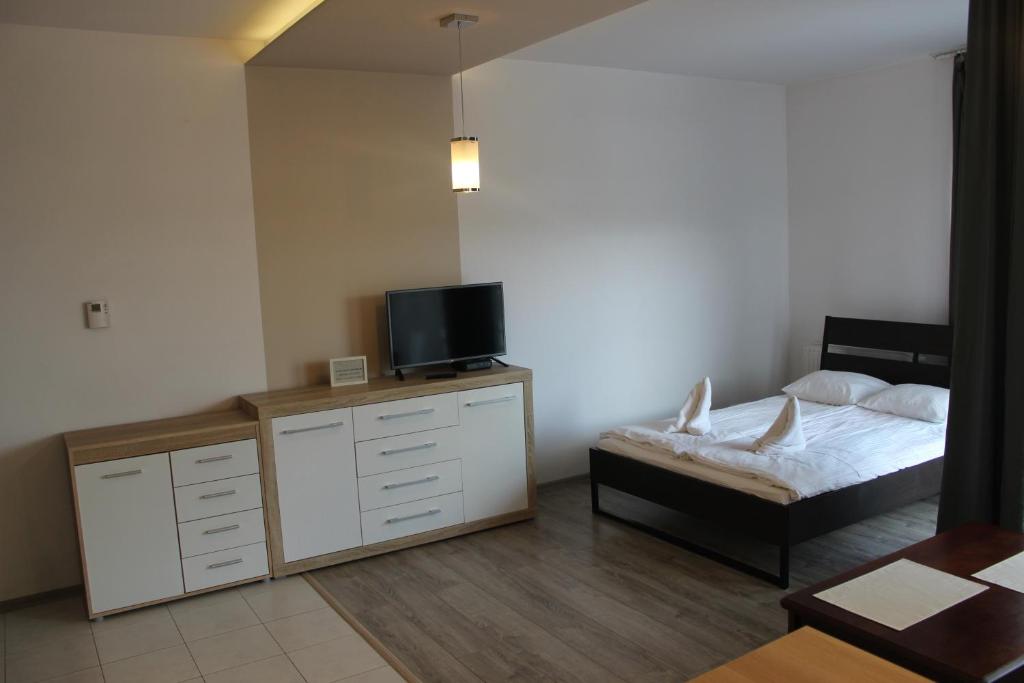 Posteľ alebo postele v izbe v ubytovaní Apartament Sadowa