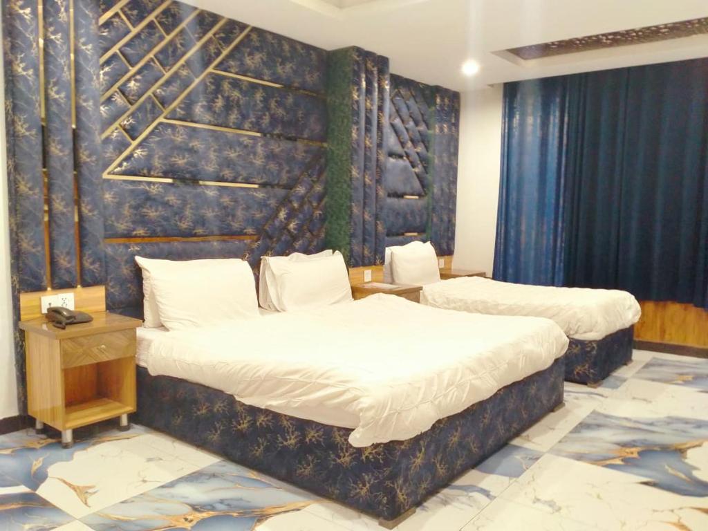 Ένα ή περισσότερα κρεβάτια σε δωμάτιο στο Hotel One Ten