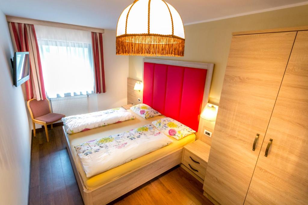 Łóżko lub łóżka w pokoju w obiekcie Apartments Diamant