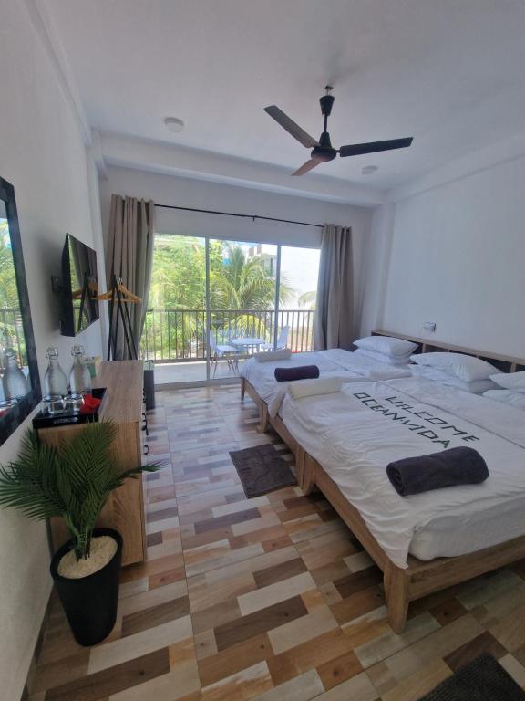 Postel nebo postele na pokoji v ubytování Ocean Vida Maldivas