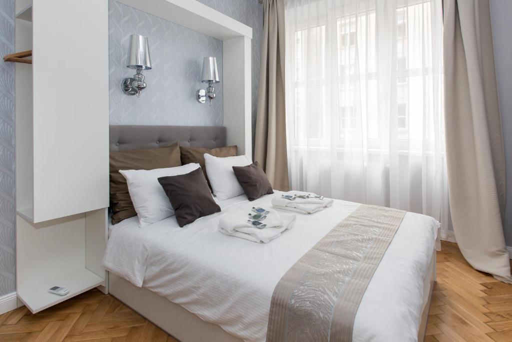 Posteľ alebo postele v izbe v ubytovaní Luxe Living Krakow