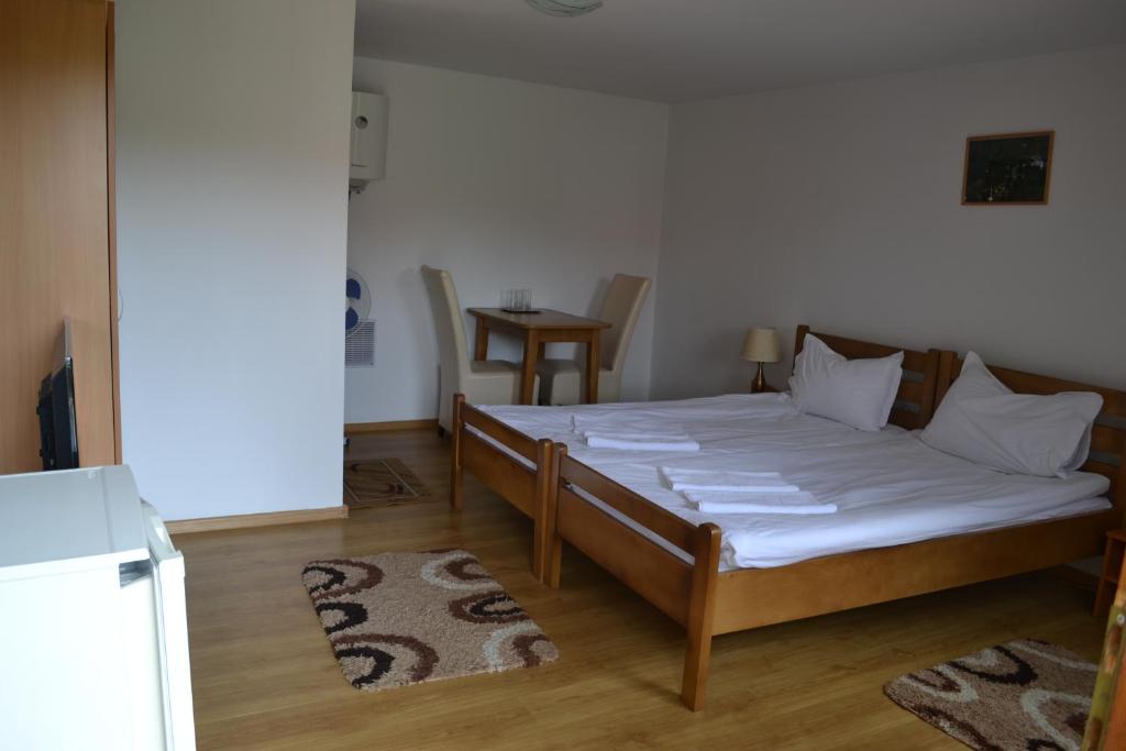 Postel nebo postele na pokoji v ubytování Vila Paula & SPA -ALL INCLUSIVE