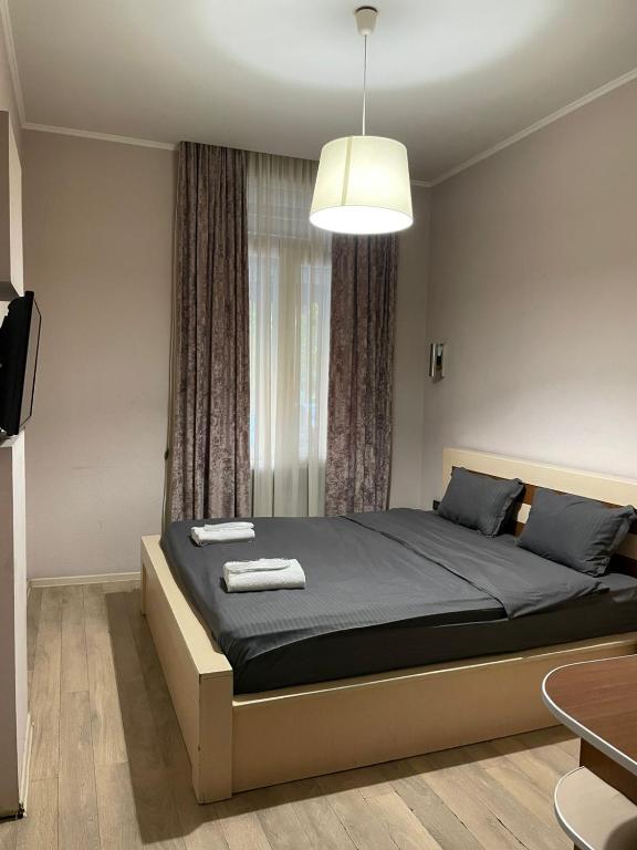 Voodi või voodid majutusasutuse Taste Tbilisi toas