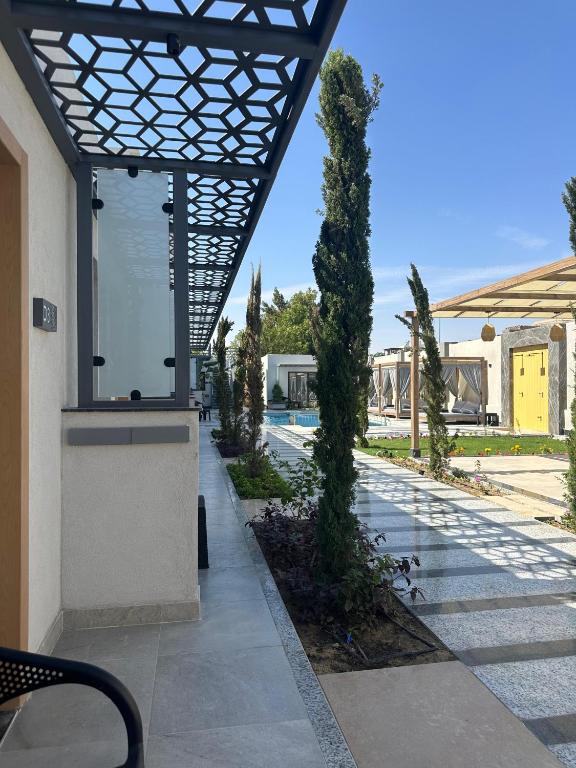 a view of a courtyard with trees and a building at The D9 Luxury Suites - Hurghada in Hurghada