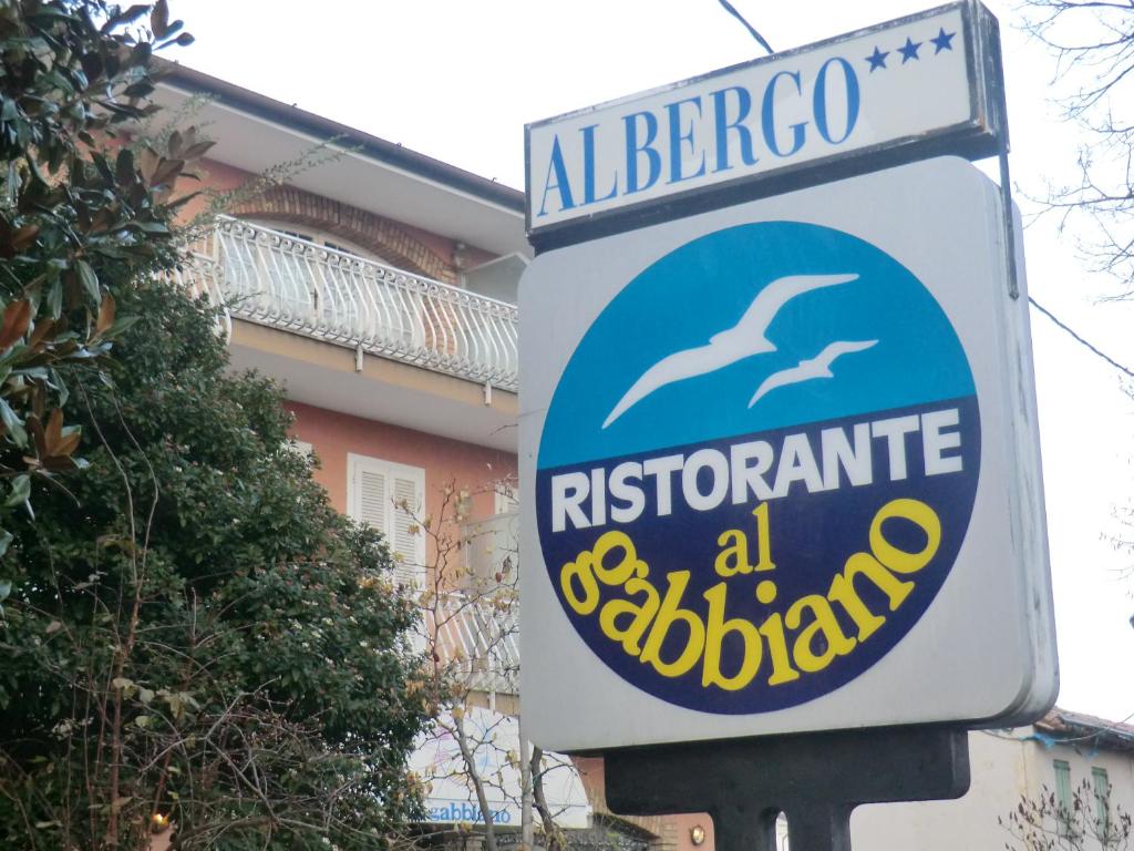 a sign for a restaurant with a dolphin on it at Hotel Ristorante al Gabbiano in Ponte di Piave