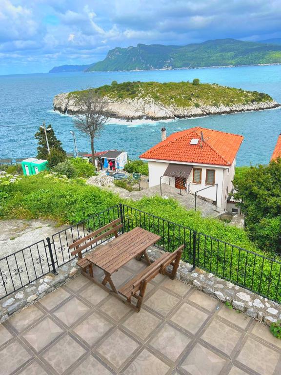 a wooden bench sitting in front of a fence at Amasra Doğa Apart in Amasra