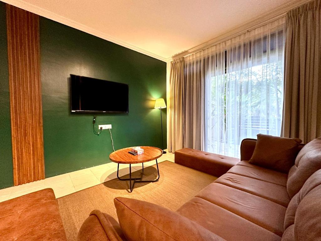 TV a/nebo společenská místnost v ubytování BNB Cozy Homestay - Cyberjaya, 14 pax