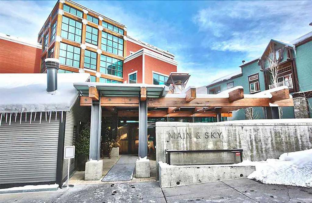 a building with a sign that says miami skylight at Main & SKY by EXMAR in Park City