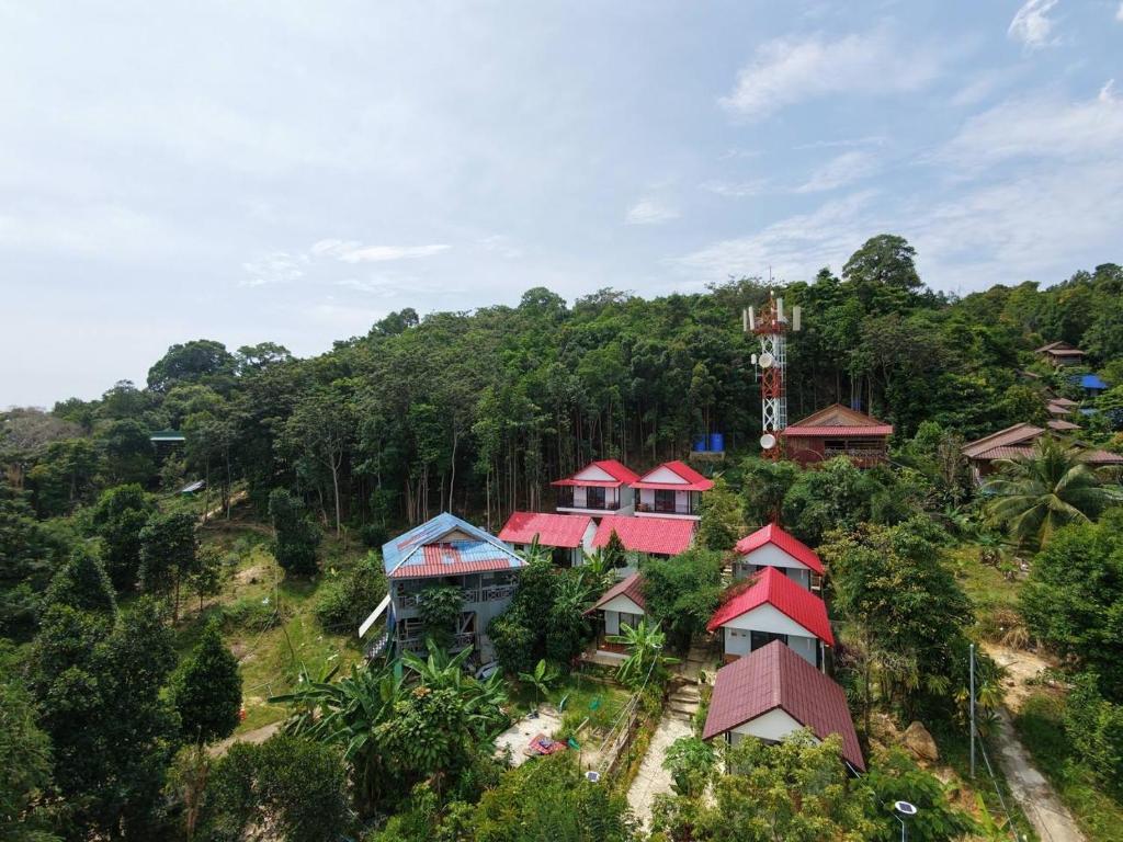 a group of houses on a hill with trees at SODANY RESORT Kohrong in Koh Rong