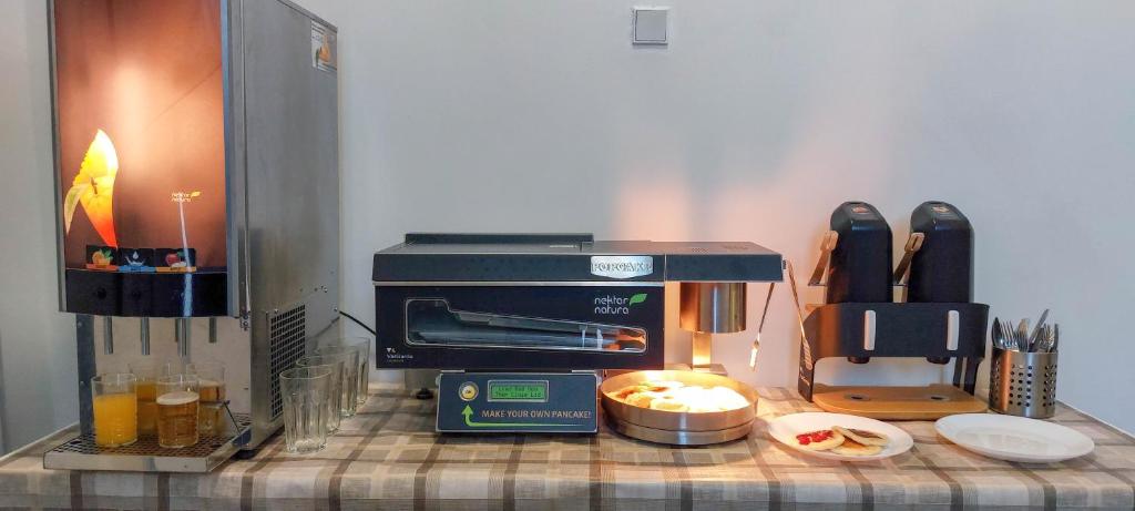 a kitchen counter with a coffee maker and a toaster at Romantický pokojíček v podkroví R5 in Prague