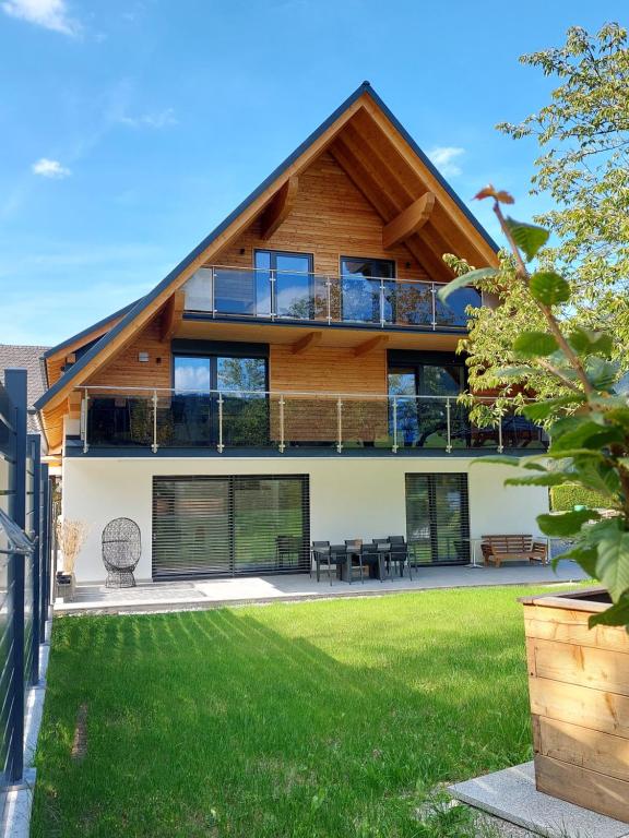 a house with a gambrel roof at Hofpower`s Mountain Feeling in Hinterstoder