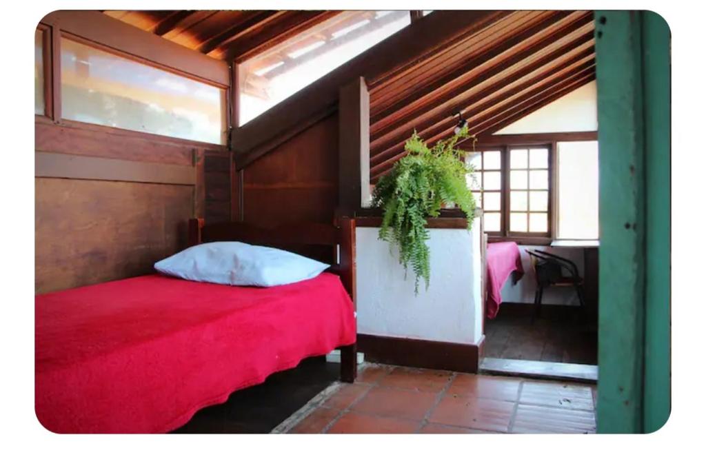 Ένα ή περισσότερα κρεβάτια σε δωμάτιο στο Hostel Karanga