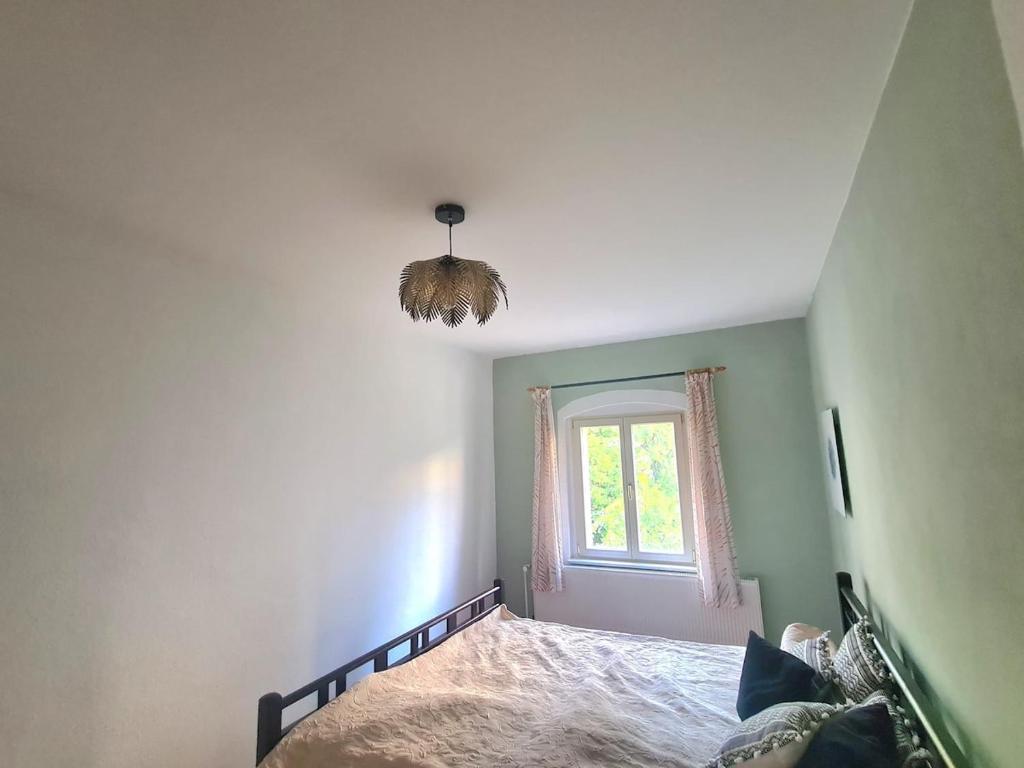 Ένα ή περισσότερα κρεβάτια σε δωμάτιο στο Townhouse in Potsdam-Babelsberg