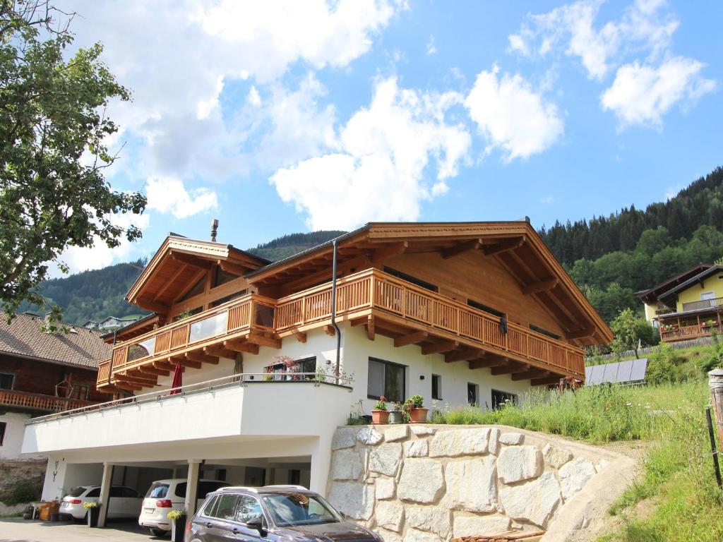 a house with a balcony on top of it at Apartment in Piesendorf near Ski Slopes in Piesendorf