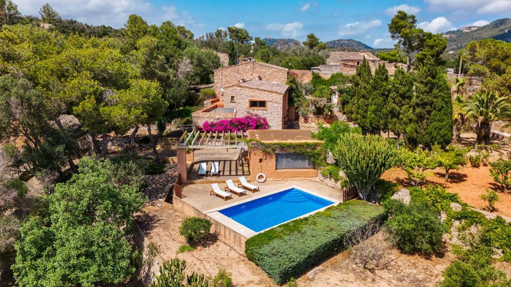 an aerial view of a house with a swimming pool at Can Pessal in Es Carritxo