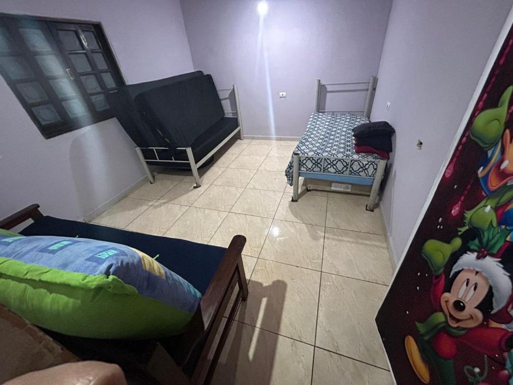 En eller flere senge i et værelse på Casa com piscina