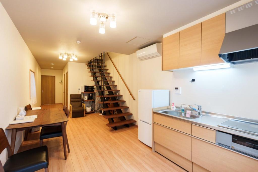 Кухня или мини-кухня в Tenjin Bridge Guestroon Maximum 10 people
