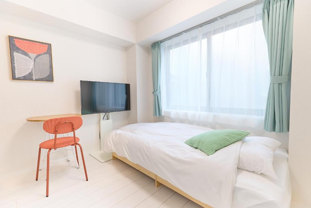 Ένα ή περισσότερα κρεβάτια σε δωμάτιο στο Zenith Nishinakanobu