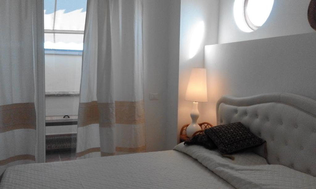 Postel nebo postele na pokoji v ubytování B&B Il Porticciolo Portoscuso