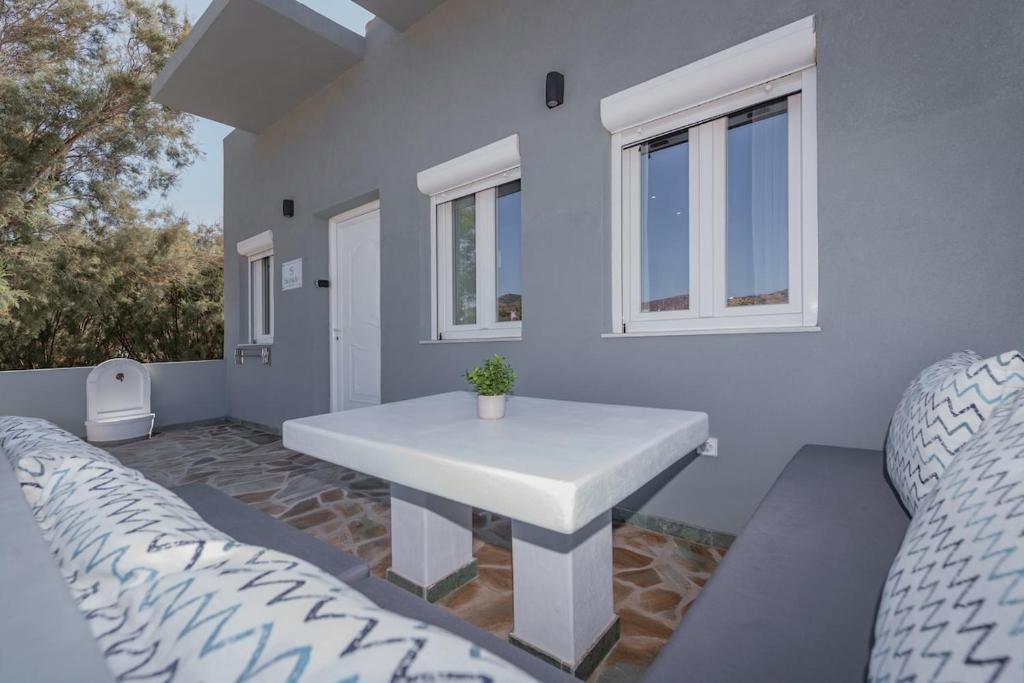 a white table in a room with two beds at Seaside Suite in Galissas