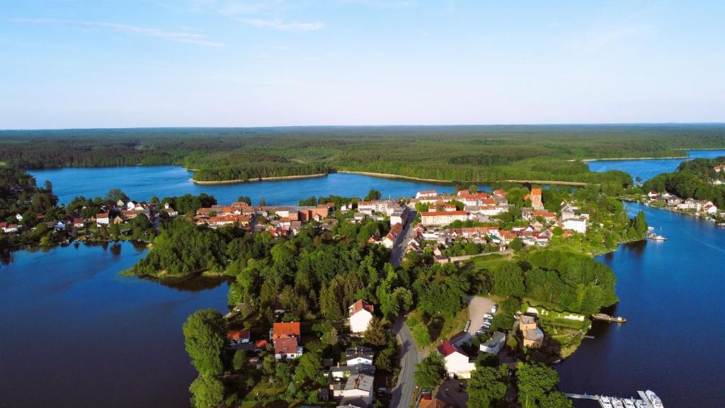 a small town on an island in the water at Alt-Berliner Schwanenhof Ferienwohnung DG rechts in Lychen