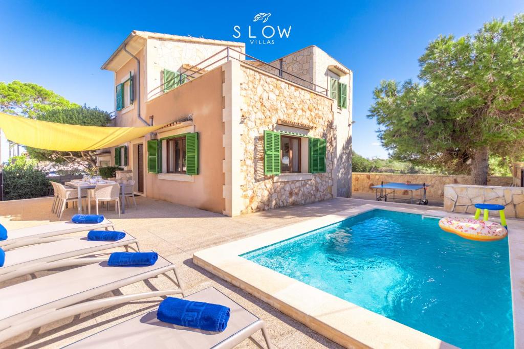 an image of a villa with a swimming pool at Villa Sa Llimonera by Slow Villas in Cala Llombards