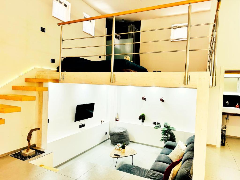 a living room with a couch and a bunk bed at Casa Terranova in Pozzallo