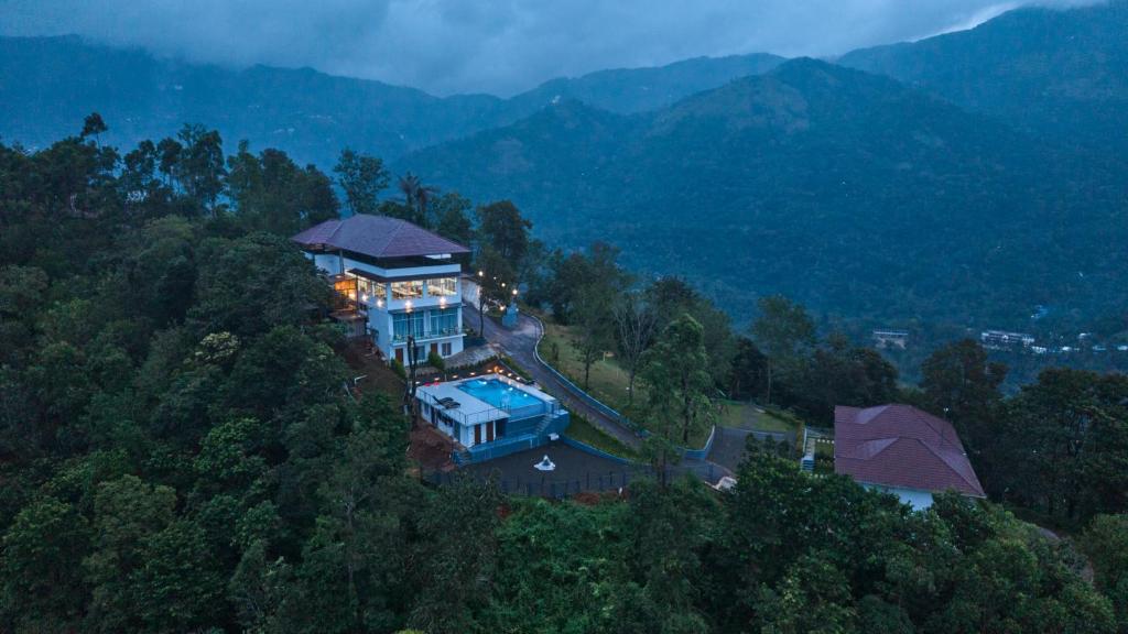 an aerial view of a house in the mountains at Zeezmount Resorts & Spa Munnar in Anachal