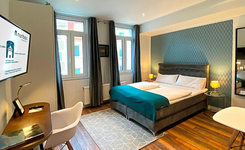 Ένα ή περισσότερα κρεβάτια σε δωμάτιο στο Nurban Apartments Oldtown