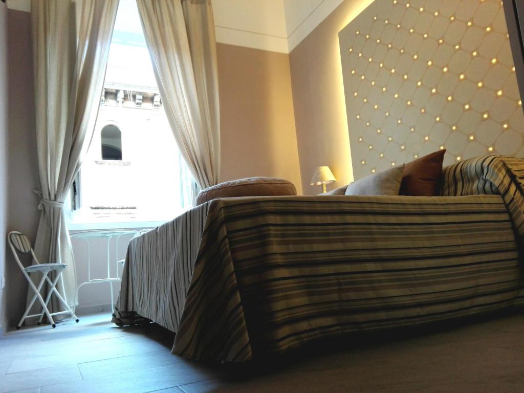 En eller flere senge i et værelse på Aleardo Aleardi